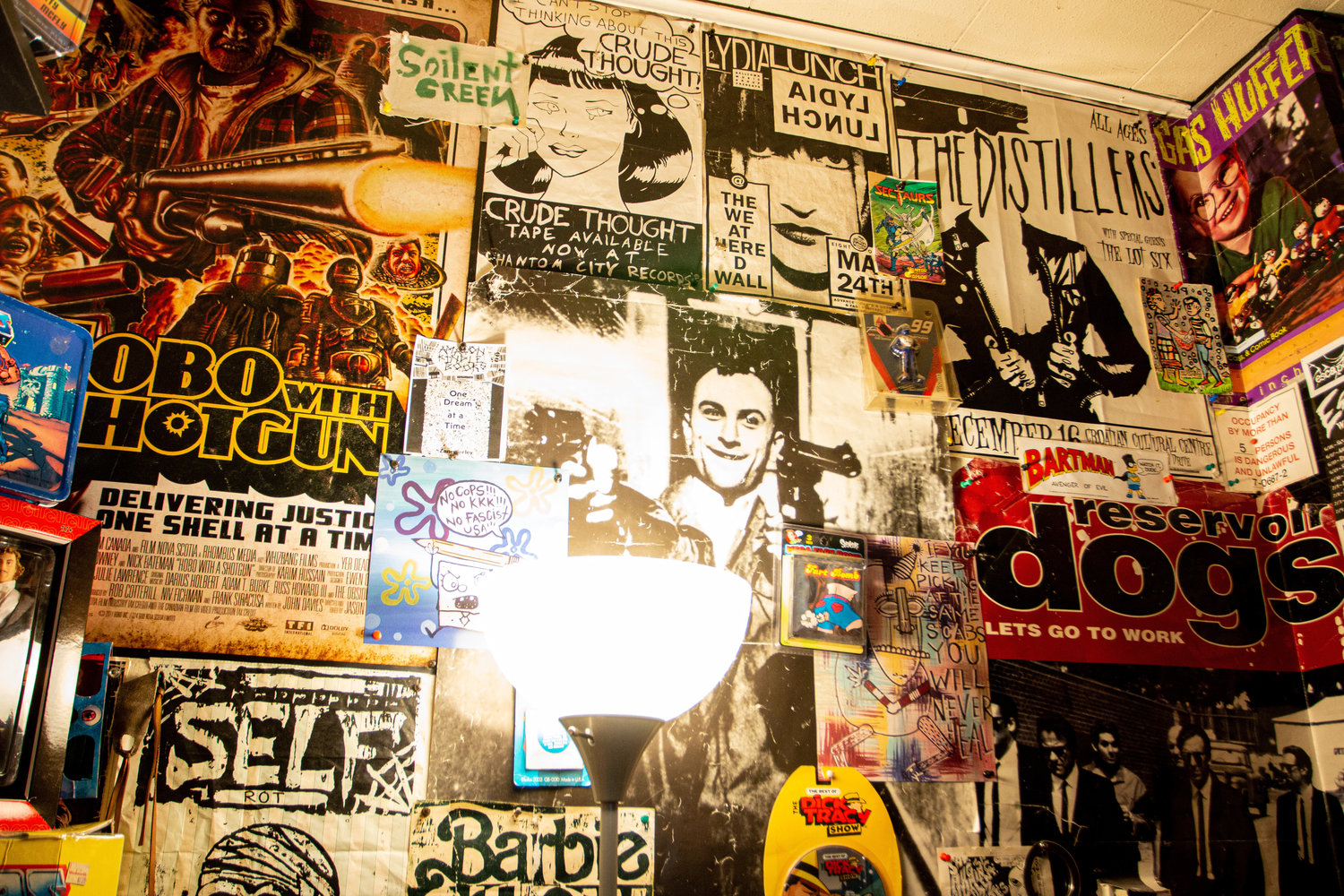A wall within the collection room is covered in vintage posters.